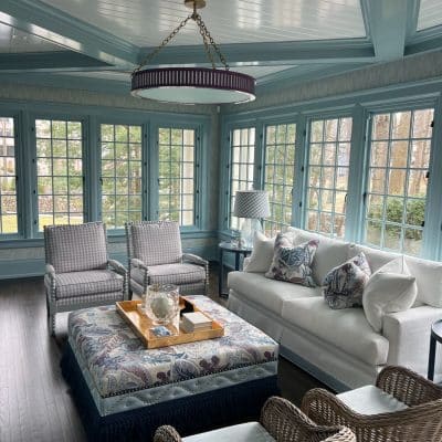 A Living Room Filled With Furniture And A Large Window