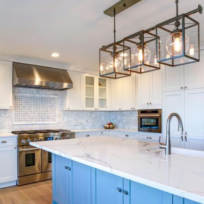 A Large Kitchen With Stainless Steel Appliances