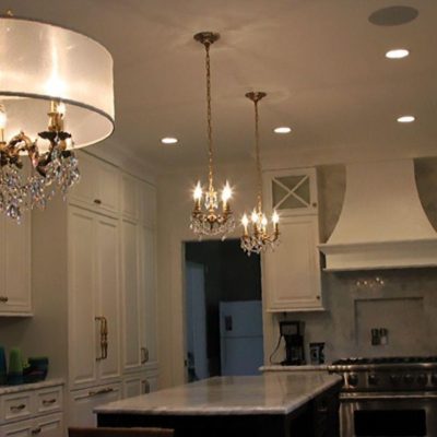 A Kitchen With A Stove And A Sink