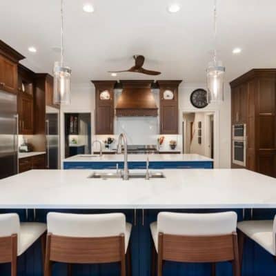 A Kitchen With A Table In A Room