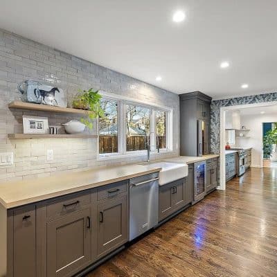 A Kitchen With A Sink And A Window