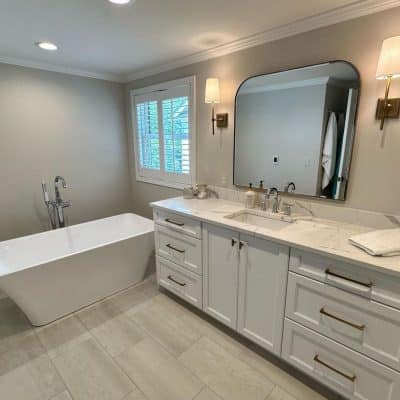 A Kitchen With A Sink And A Mirror